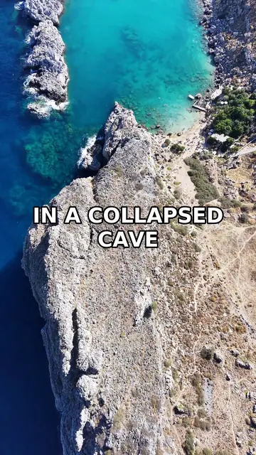 One frame of a real LoopBatch video: an aerial view of a turquoise cove between rocks in Greece, with the burned-in caption IN A COLLAPSED CAVE